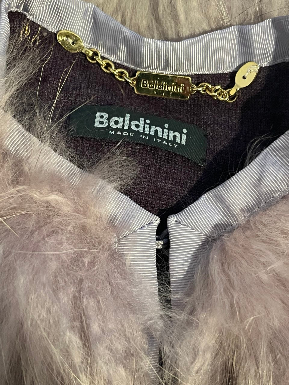 Lavender vest with Finnish raccoon fur