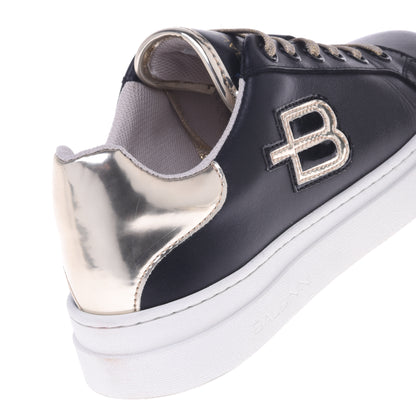 Sneakers noir et or en cuir de veau