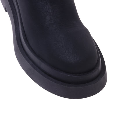 Bottes noires en simili cuir extensible