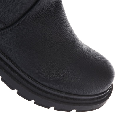 Black vegetable-tanned stretch leather boots