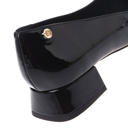 Black patent leather pumps