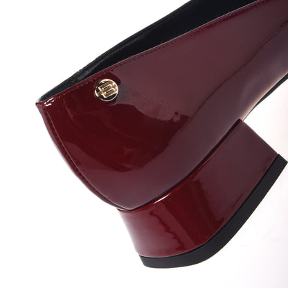 Burgundy patent leather pumps