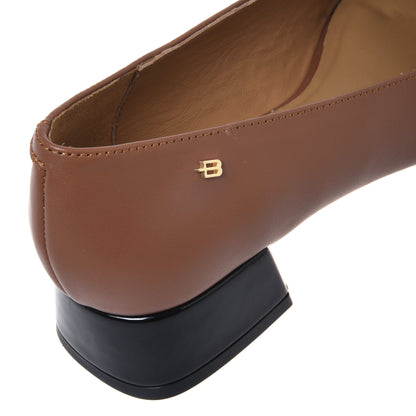 Brown leather and black patent leather court shoe