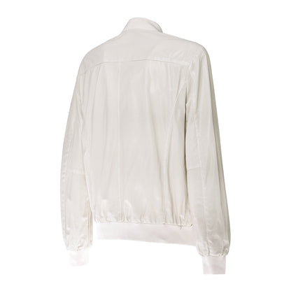 Blouson bomber réversible en cuir perforé et tissu beige
