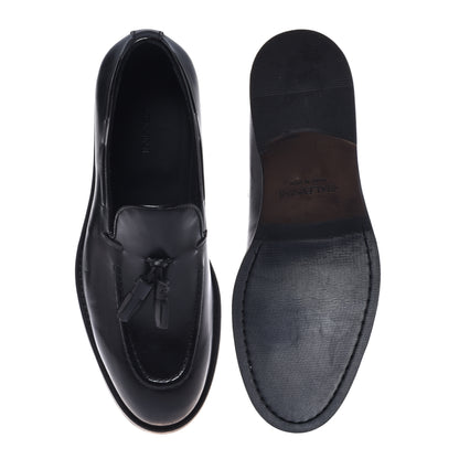 Black leather slip-ons