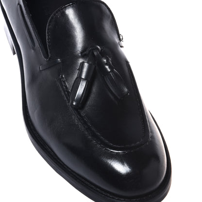 Black leather slip-ons